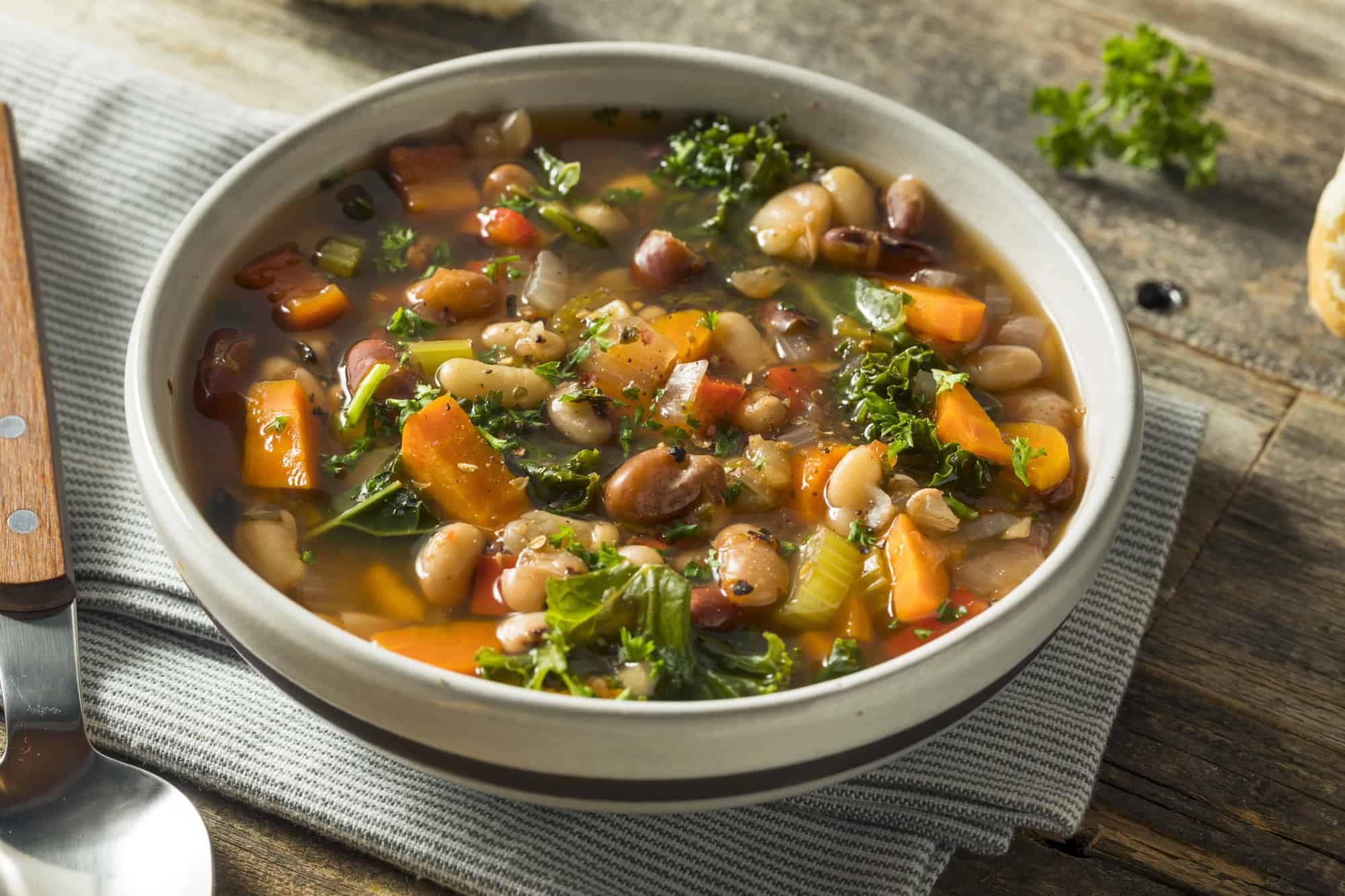 Bowl of mixed bean and vegetable soup rich in fiber and plant-based nutrients