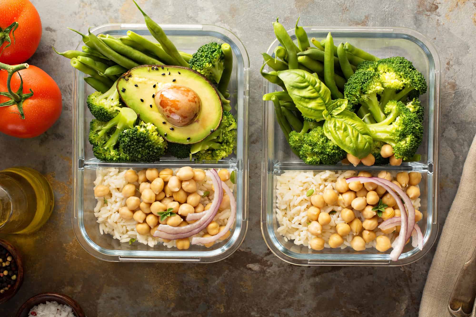 Vegetarian meal prep containers with chickpeas, rice, avocado, and broccoli for high protein vegetarian meals