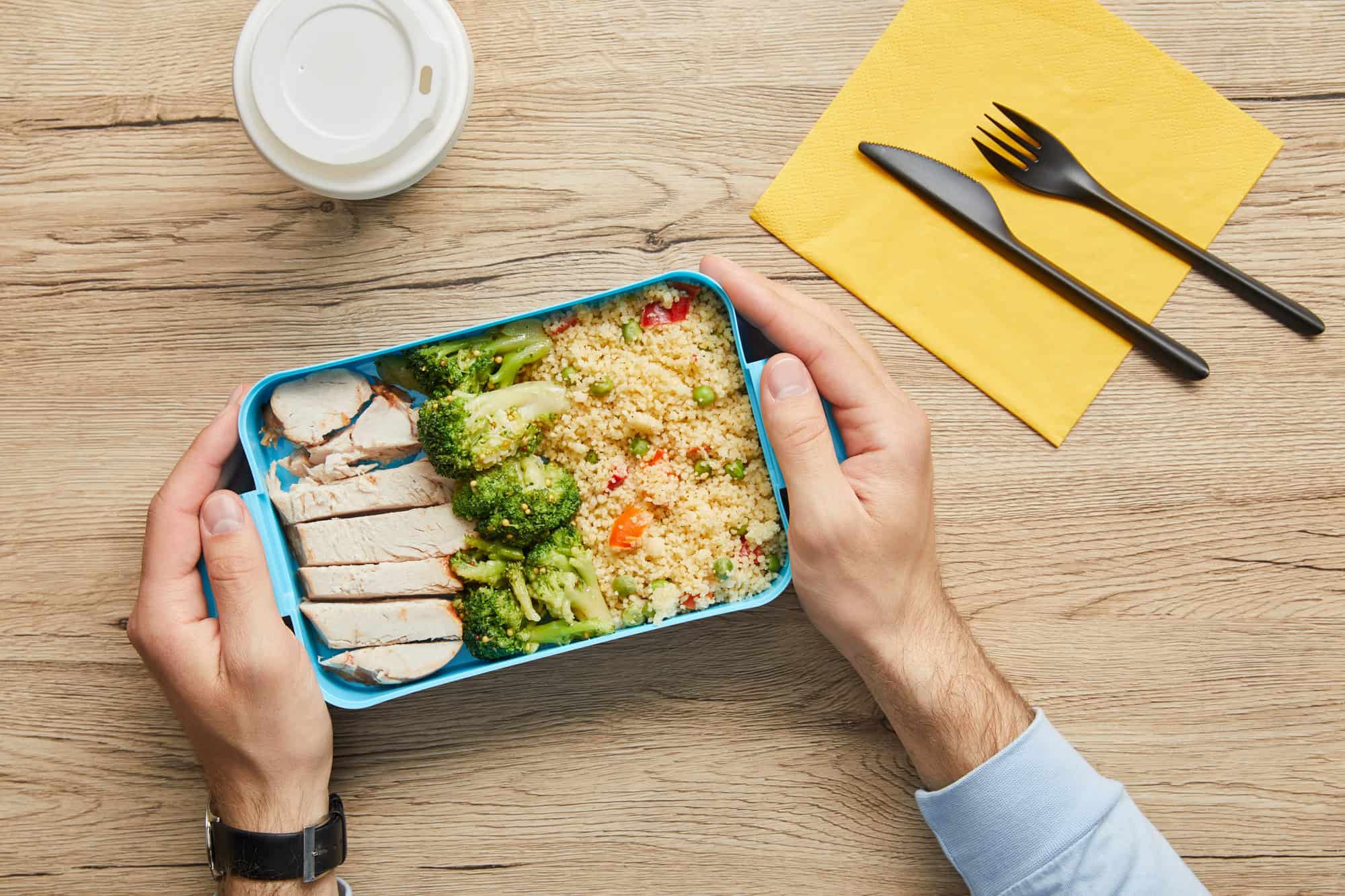 Packed lunchbox with turkey, broccoli, and couscous as part of cheap high protein meals for budget-friendly meal prep