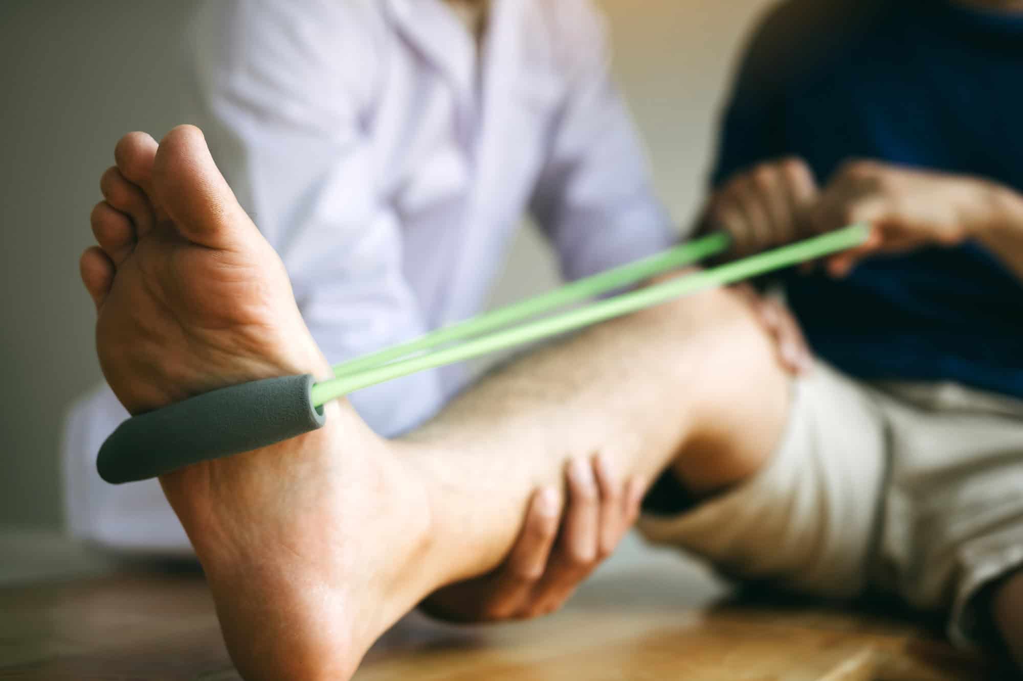 Patient use resistance band stretching - How to start working out again after knee injury