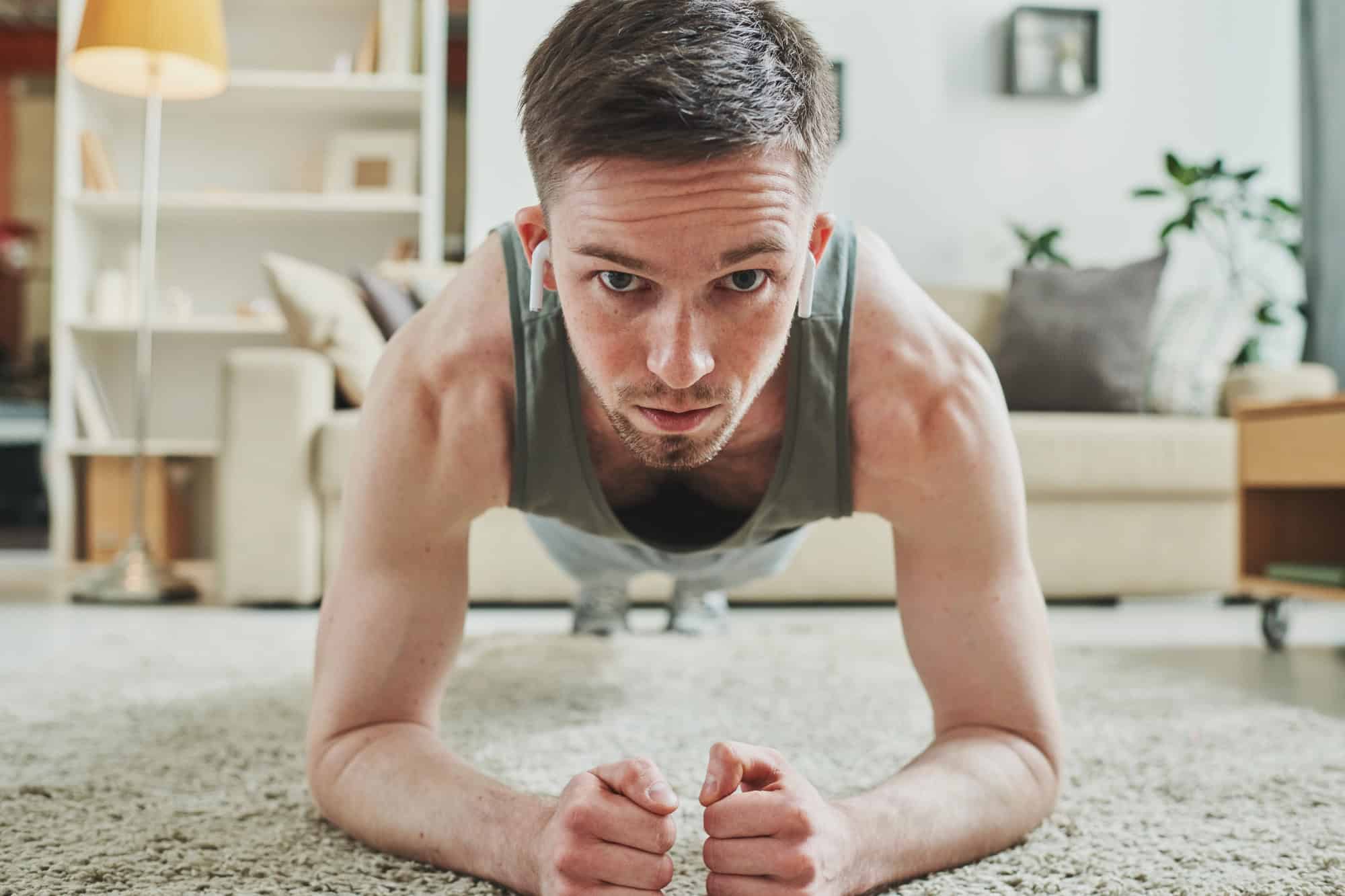Man doing plank with during a full body routine