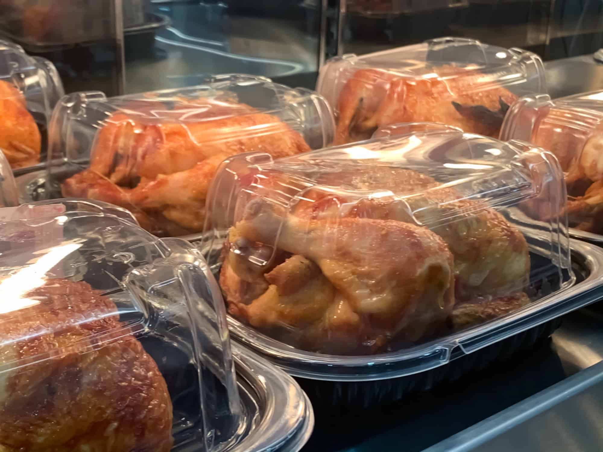 Rotisserie chicken served in a container as an easy high protein lunch option for quick, budget-friendly meals