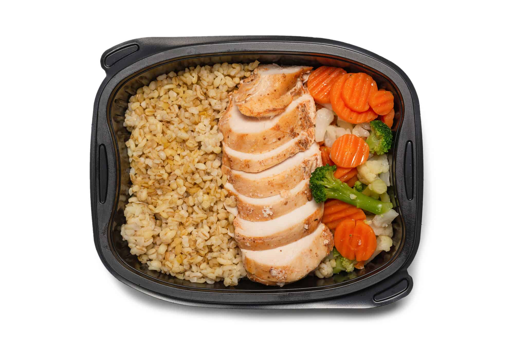 Microwaveable tray with chicken breast, rice, and mixed vegetables as a convenient high protein frozen meal