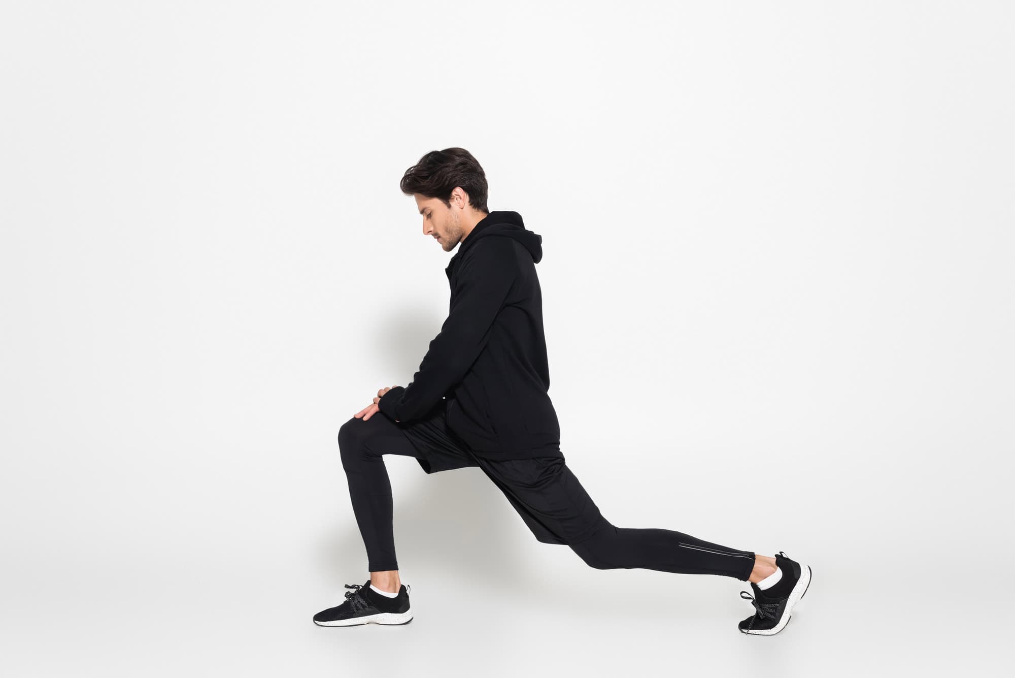 Bodyweight Leg Workout – Forward Lunges for Quads and Glutes Man performing forward lunges in a bodyweight leg workout routine